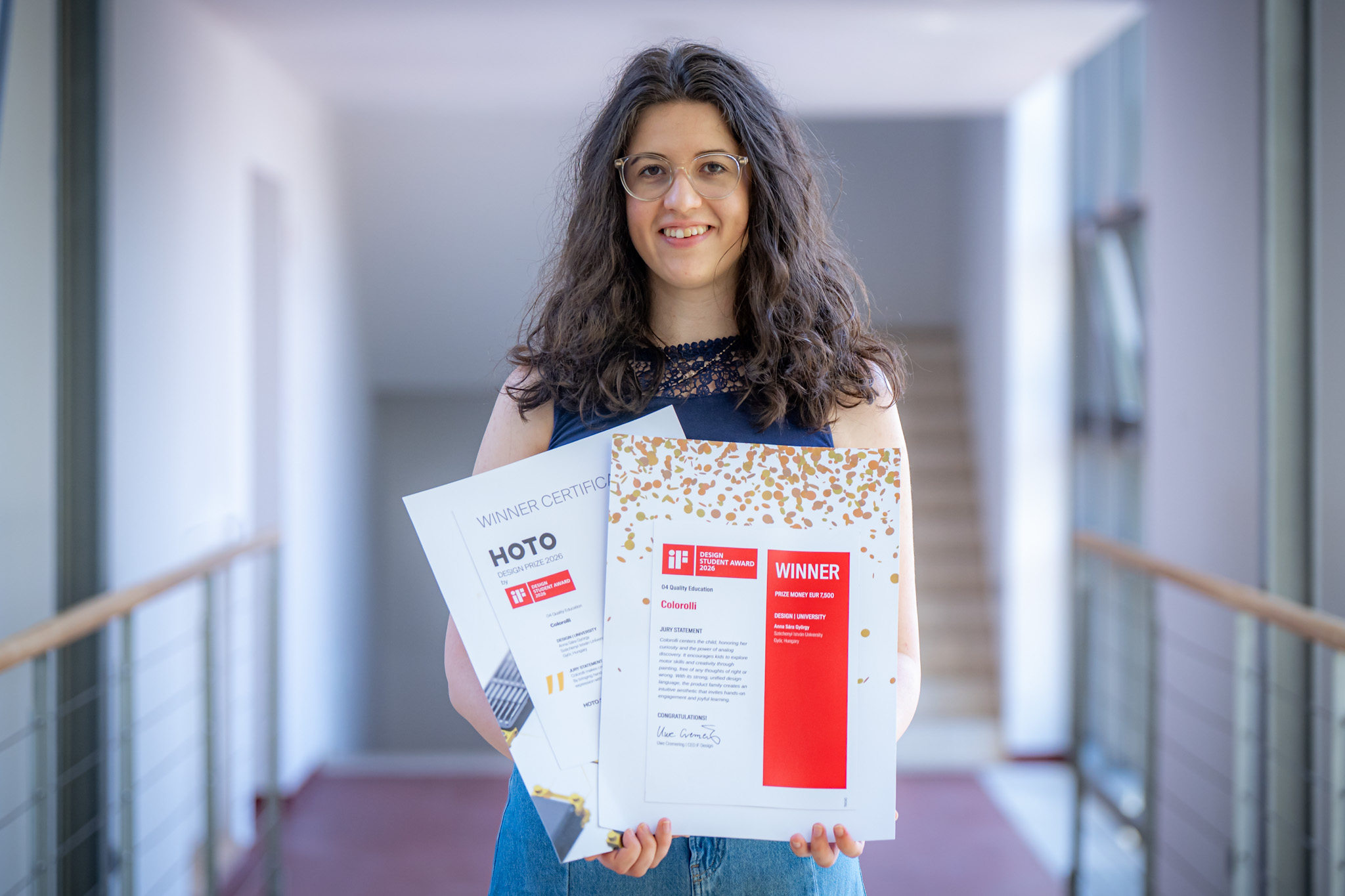 Anna Sára György with the iF Design Student Award 2026 recognition and the certificate for the HOTO Design Prize by iF special award, both received for the development of Colorolli. (Photo: András Adorján)